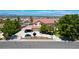 Two-story home with a red tile roof, landscaped yard, car port, and a mountain view at 1345 Morning Sun Way, Las Vegas, NV 89110