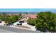 Charming two-story home with a tile roof, mature trees, and views of the Las Vegas skyline at 1345 Morning Sun Way, Las Vegas, NV 89110