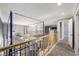 Second story hallway with wood trim and an overview of downstairs at 1345 Morning Sun Way, Las Vegas, NV 89110