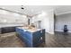 Spacious kitchen featuring modern, streamlined cabinets, a central island, and neutral tones at 1345 Morning Sun Way, Las Vegas, NV 89110