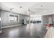 Open-concept living area with tiled floors, neutral paint and modern open kitchen at 1345 Morning Sun Way, Las Vegas, NV 89110