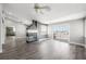 Bright living room with wood floors, a statement fireplace, and sliding glass doors at 1345 Morning Sun Way, Las Vegas, NV 89110