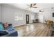 Comfortable living room with wood floors, natural light, and a cozy seating arrangement at 1345 Morning Sun Way, Las Vegas, NV 89110