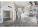 Open concept living room with tile flooring and access to the second floor at 1345 Morning Sun Way, Las Vegas, NV 89110