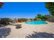 Relaxing pool area with a waterfall feature, lounge chairs, and lush landscaping offering privacy at 1345 Morning Sun Way, Las Vegas, NV 89110