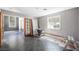 Bright room with tile flooring and large windows offers plenty of natural light at 1345 Morning Sun Way, Las Vegas, NV 89110