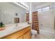 Well-lit bathroom with a single sink vanity and a shower-tub combination at 1620 Fieldbrook St, Henderson, NV 89052