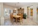 Bright dining area features a classic wooden table and chairs, complemented by a china cabinet and a view of the outdoors at 1620 Fieldbrook St, Henderson, NV 89052
