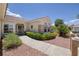 Inviting single-story home with manicured shrubs, a tiled roof, and a covered front entrance at 1620 Fieldbrook St, Henderson, NV 89052