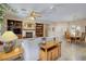 Cozy living room featuring a fireplace, built-in bookshelves, and adjacent dining area at 1620 Fieldbrook St, Henderson, NV 89052