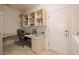 Functional home office with built-in shelves, desk, and a comfortable chair at 1620 Fieldbrook St, Henderson, NV 89052