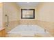 Inviting bathroom featuring a jetted soaking tub with a marble surround at 2000 N Fashion Show Dr # 2704, Las Vegas, NV 89109