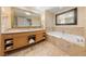 Luxurious bathroom with a soaking tub, double vanity, and marble accents for a spa-like retreat at 2000 N Fashion Show Dr # 2704, Las Vegas, NV 89109