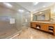 Modern bathroom with a glass-enclosed shower and double sink vanity providing a spa-like experience at 2000 N Fashion Show Dr # 2704, Las Vegas, NV 89109