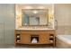 Elegant bathroom featuring double sinks, a large mirror, and ample cabinet space for storage at 2000 N Fashion Show Dr # 2704, Las Vegas, NV 89109