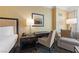 Bedroom featuring a comfortable bed, desk and chair with patterned black and white carpeting at 2000 N Fashion Show Dr # 2704, Las Vegas, NV 89109