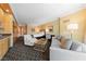 Cozy living area featuring a kitchenette, a comfortable sofa, bedroom access, and patterned black and white carpeting at 2000 N Fashion Show Dr # 2704, Las Vegas, NV 89109