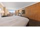 A comfortable main bedroom featuring a king bed, sitting area, and kitchenette with city views at 2000 N Fashion Show Dr # 2704, Las Vegas, NV 89109