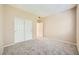 Comfortable bedroom featuring carpeted floors, closet, and neutral wall color at 2108 Calville St # 104, Las Vegas, NV 89128