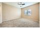 Cozy bedroom with plush carpet, a window for natural light, and neutral decor at 2108 Calville St # 104, Las Vegas, NV 89128