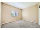 Bright bedroom with new carpet, a window, and neutral paint at 2108 Calville St # 104, Las Vegas, NV 89128