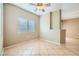Bright breakfast nook featuring tile floors, a ceiling fan, and a large window for natural light at 2108 Calville St # 104, Las Vegas, NV 89128