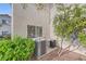 Exterior shot of A/C units near the building with greenery and rock landscaping at 2108 Calville St # 104, Las Vegas, NV 89128