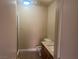 Well-lit bathroom featuring a shower, toilet, and single sink vanity at 228 Caracas Dr, Las Vegas, NV 89145