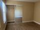 Cozy bedroom with wood floors and large mirrored closet at 228 Caracas Dr, Las Vegas, NV 89145