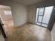 Bedroom featuring neutral tile flooring and sliding glass doors leading to the outside at 2318 El Molino Cir, Las Vegas, NV 89108