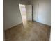 Bedroom featuring view to a room with a window at 2318 El Molino Cir, Las Vegas, NV 89108