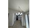 Cozy dining area with tile floors, a modern chandelier, and direct access to the kitchen at 2318 El Molino Cir, Las Vegas, NV 89108