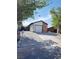 This single-story home boasts a well-manicured front yard and a two-car garage, blending comfort and practicality at 2318 El Molino Cir, Las Vegas, NV 89108