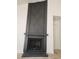 Contemporary fireplace design with painted woodwork and dark brick details at 2318 El Molino Cir, Las Vegas, NV 89108