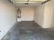 Interior view of the garage showing a water heater on the left and an open space at 2318 El Molino Cir, Las Vegas, NV 89108