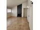 Living room featuring tile flooring, modern lighting and a dark fireplace feature at 2318 El Molino Cir, Las Vegas, NV 89108