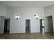 Open-concept living area highlighting high ceilings, neutral paint, and abundant natural light at 2318 El Molino Cir, Las Vegas, NV 89108