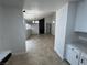Open living room featuring tile flooring, modern lighting and a fireplace feature at 2318 El Molino Cir, Las Vegas, NV 89108