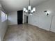 Bright living room with tile floors, a stylish chandelier, and a modern fireplace feature at 2318 El Molino Cir, Las Vegas, NV 89108