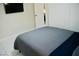 Cozy bedroom with a comfortable bed, sleek TV, and a spacious closet at 2659 Vegas Valley Dr, Las Vegas, NV 89121