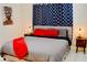Bedroom with queen bed, stylish side tables and modern patterned curtains at 2659 Vegas Valley Dr, Las Vegas, NV 89121