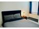Modern bedroom featuring queen bed, side table and patterned rug at 2659 Vegas Valley Dr, Las Vegas, NV 89121