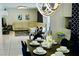 This modern dining room features an elegant chandelier and stylish decor at 2659 Vegas Valley Dr, Las Vegas, NV 89121