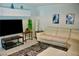 Bright living room featuring a modern white leather sofa, sleek furniture, and stylish decor at 2659 Vegas Valley Dr, Las Vegas, NV 89121
