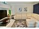 Comfortable living room featuring a large sectional sofa, modern decor, and stylish rug at 2659 Vegas Valley Dr, Las Vegas, NV 89121