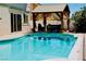 Inviting outdoor pool area with a gazebo and comfortable seating for relaxation at 2659 Vegas Valley Dr, Las Vegas, NV 89121