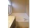 Bathroom featuring a built-in tub and vanity with natural light at 3116 Gentle Breeze St, Las Vegas, NV 89108