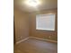 Bright bedroom with laminate flooring, neutral walls, and a window with blinds at 3116 Gentle Breeze St, Las Vegas, NV 89108