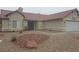 Charming single-story home with a tile roof and low-maintenance desert landscaping in the front yard at 3116 Gentle Breeze St, Las Vegas, NV 89108