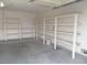 Organized garage features a pegboard and long white storage shelves to maximize space and storage at 3116 Gentle Breeze St, Las Vegas, NV 89108